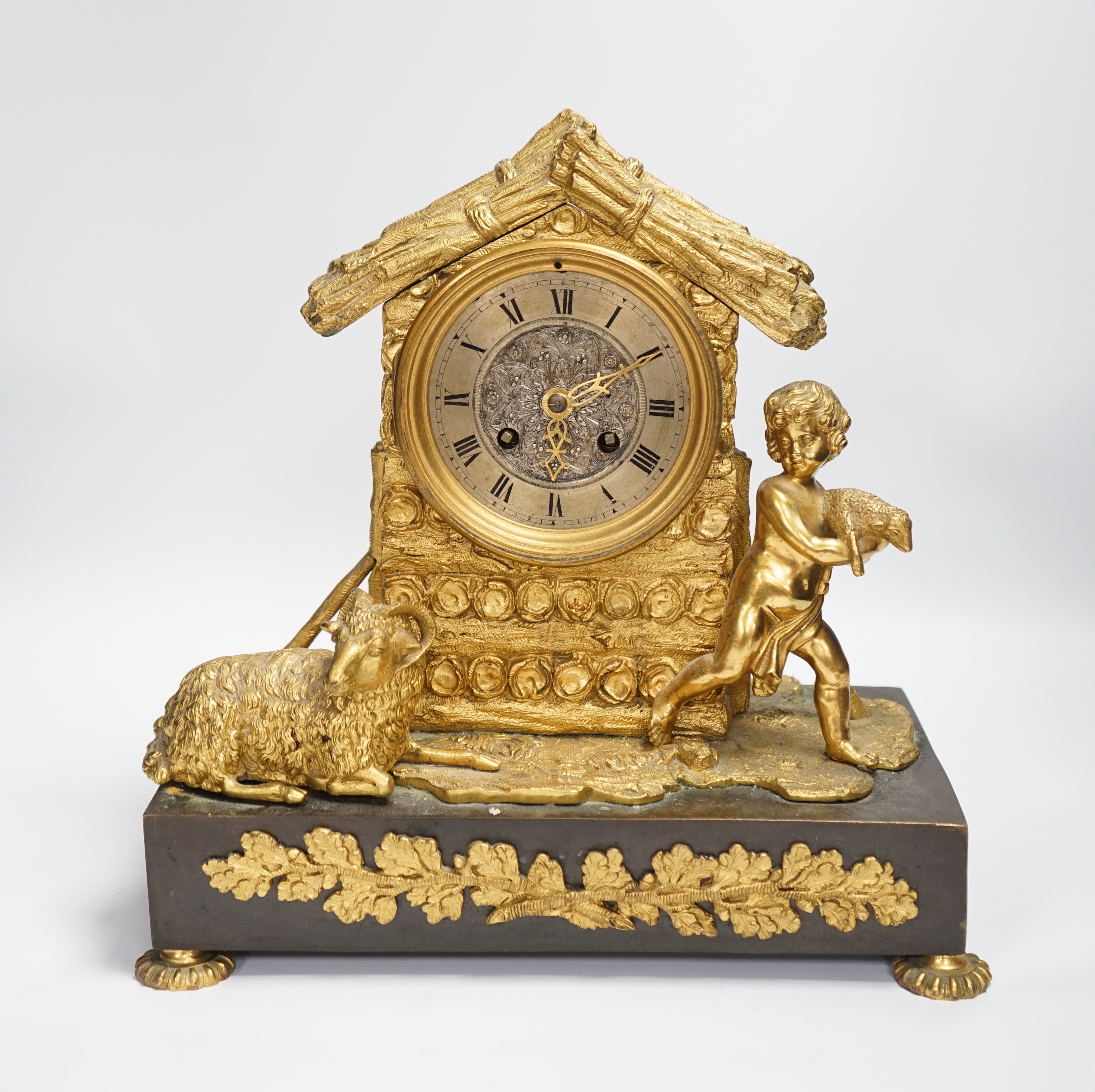 A 19th century ormolu clock, Richard & Cie stamped movement, case formed as a log cabin with child and sheep figural group, 30cm high